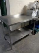 A stainless steel two tier prep table,