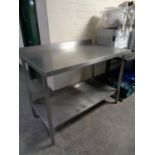 A stainless steel two tier prep table,