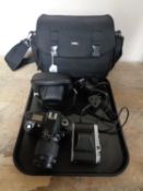 A camera bag of Pentax K1000 camera with 50 mm lens, Nikon D70 digital camera with lens,