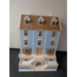 A Georgian style double fronted doll's house together with two boxes containing a large quantity of