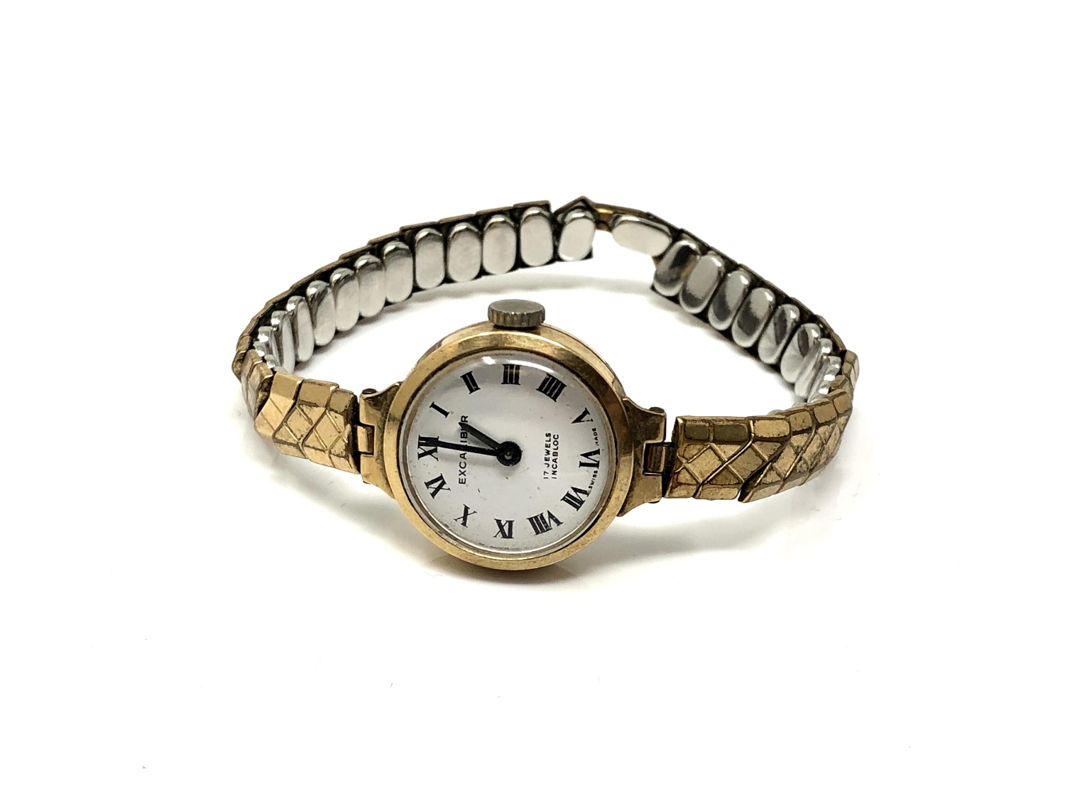 A lady's 9ct gold cased Excalibur wristwatch on gilt expanding strap.