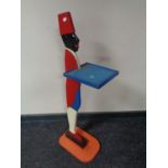 A painted figural dumb waiter