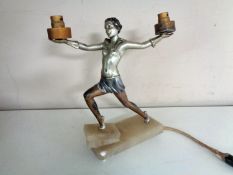 An Art Deco figural two-way table lamp of a lady in the manner of Josef Lorenzl,