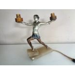 An Art Deco figural two-way table lamp of a lady in the manner of Josef Lorenzl,