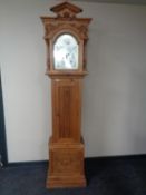 A carved pine cased Tempus Fugit grandfather clock.