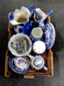 A box of antique and later blue and white wares to include wash jug, chamber pot,