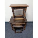 An Edwardian joined oak stool and a nest of three similar oak tables