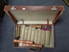 A vintage leather luggage case containing antiquarian and later volumes to include Tennyson,