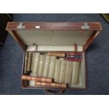 A vintage leather luggage case containing antiquarian and later volumes to include Tennyson,