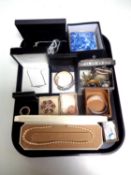 A tray containing a quantity of boxed costume jewellery to include brooches, bangles, necklaces,