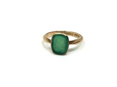 A 9ct gold intaglio ring set with a green stone, size M. CONDITION REPORT: 1.