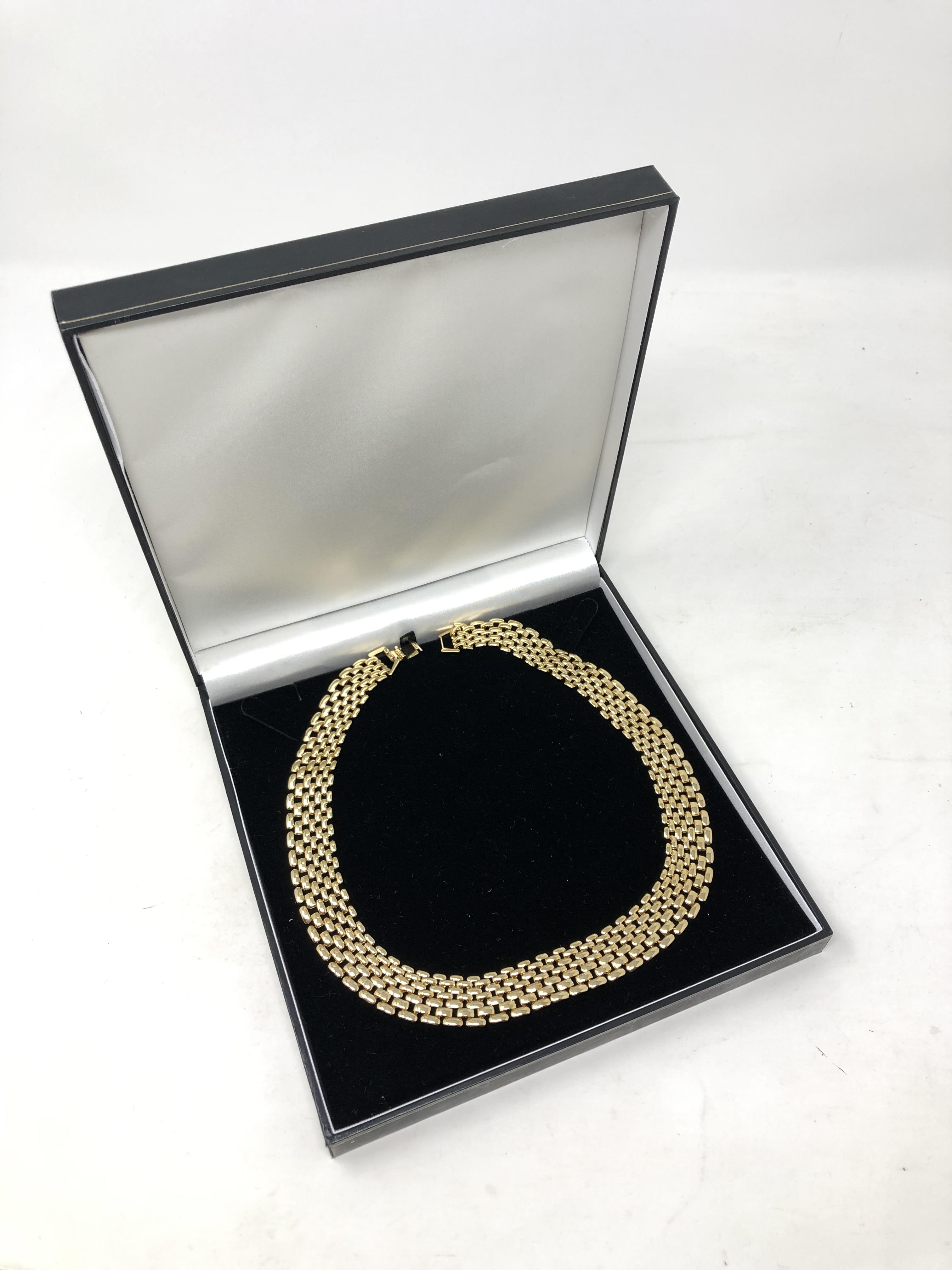 A gold plated flat link necklace.
