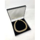 A gold plated flat link necklace.