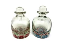 Two antique glass scent bottles with millefiore base decoration, height 14 cm.