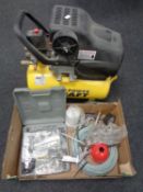 A Powercraft compressor together with a box containing a large quantity of compressor accessories.