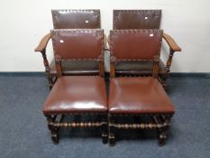 A set of four oak leather buttoned dining chairs comprising of two carvers and two singles