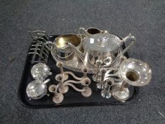 A tray containing plated wares to include three piece tea service on gallery tray, toast rack,