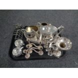A tray containing plated wares to include three piece tea service on gallery tray, toast rack,