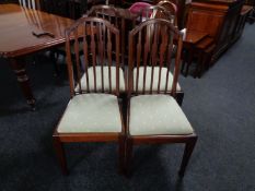 A set of four Edwardian mahogany rail back dining chairs