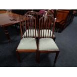 A set of four Edwardian mahogany rail back dining chairs