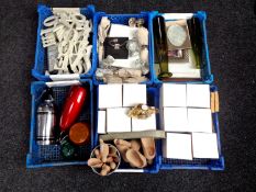 Six plastic crates containing miscellaneous to include tea light holders, napkins and napkin rings,