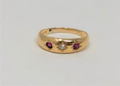 An 18ct gold diamond and garnet ring, size O1/2 CONDITION REPORT: 2.