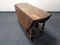 A 19th century oak gate leg table.