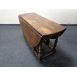 A 19th century oak gate leg table.