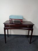 A Stag Minstrel console table and a further upholstered footstool