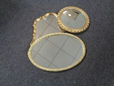 A gilt framed circular porthole style bevelled mirror and two further gilt framed mirrors