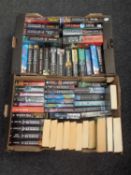 Five boxes containing paperback and hardback books to include a large quantity of Clive Cussler