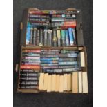 Five boxes containing paperback and hardback books to include a large quantity of Clive Cussler