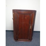 A late 18th/ early 19th century hanging corner cabinet.