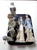 A tray of Nao figure of a lady seated in blue dress,