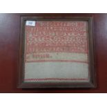 A Late 19th Century sampler, 26 cm x 26 cm, with interesting hand-written note taped verso, framed.