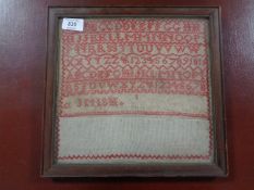 A Late 19th Century sampler, 26 cm x 26 cm, with interesting hand-written note taped verso, framed.