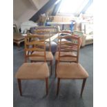 A set of four teak G-Plan dining chairs
