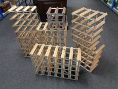 Seven wood and metal wine racks of various sizes