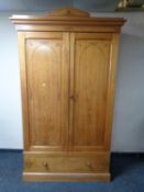 An Aesthetic period pine double door wardrobe fitted drawer beneath