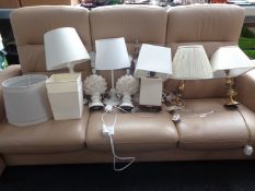 Nine assorted ceramic and brass table lamps with shades