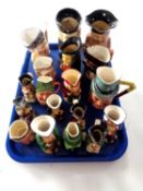 A tray containing assortment of Toby jugs.