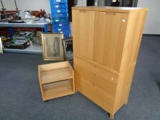 An office double door storage cupboard with matching three drawer chest and two tier book table in