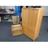 An office double door storage cupboard with matching three drawer chest and two tier book table in