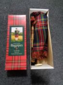 A boxed set of Junior Playable bagpipes