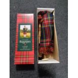 A boxed set of Junior Playable bagpipes