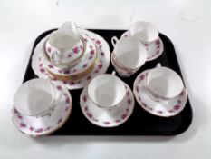 A tray of twenty one piece Queen Anne rose pattern tea service