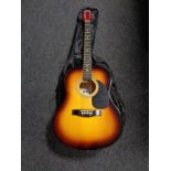 A 3rd Avenue acoustic guitar in carry bag with music book