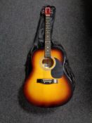 A 3rd Avenue acoustic guitar in carry bag with music book