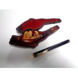 A lighter in the form of a pen together with a cased Meerschaum pipe.