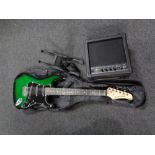 A Display4Top electric guitar in carry bag together with a Display4Top EG-20W amplifier and a